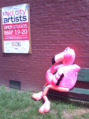 photograph of giant pink ostrich sitting on a park bench in Washington DC 